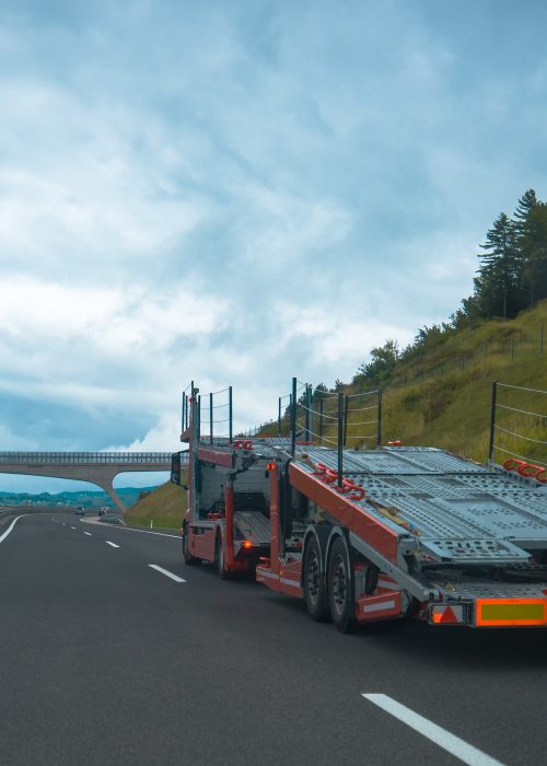 Semi truck with car carrier trailer